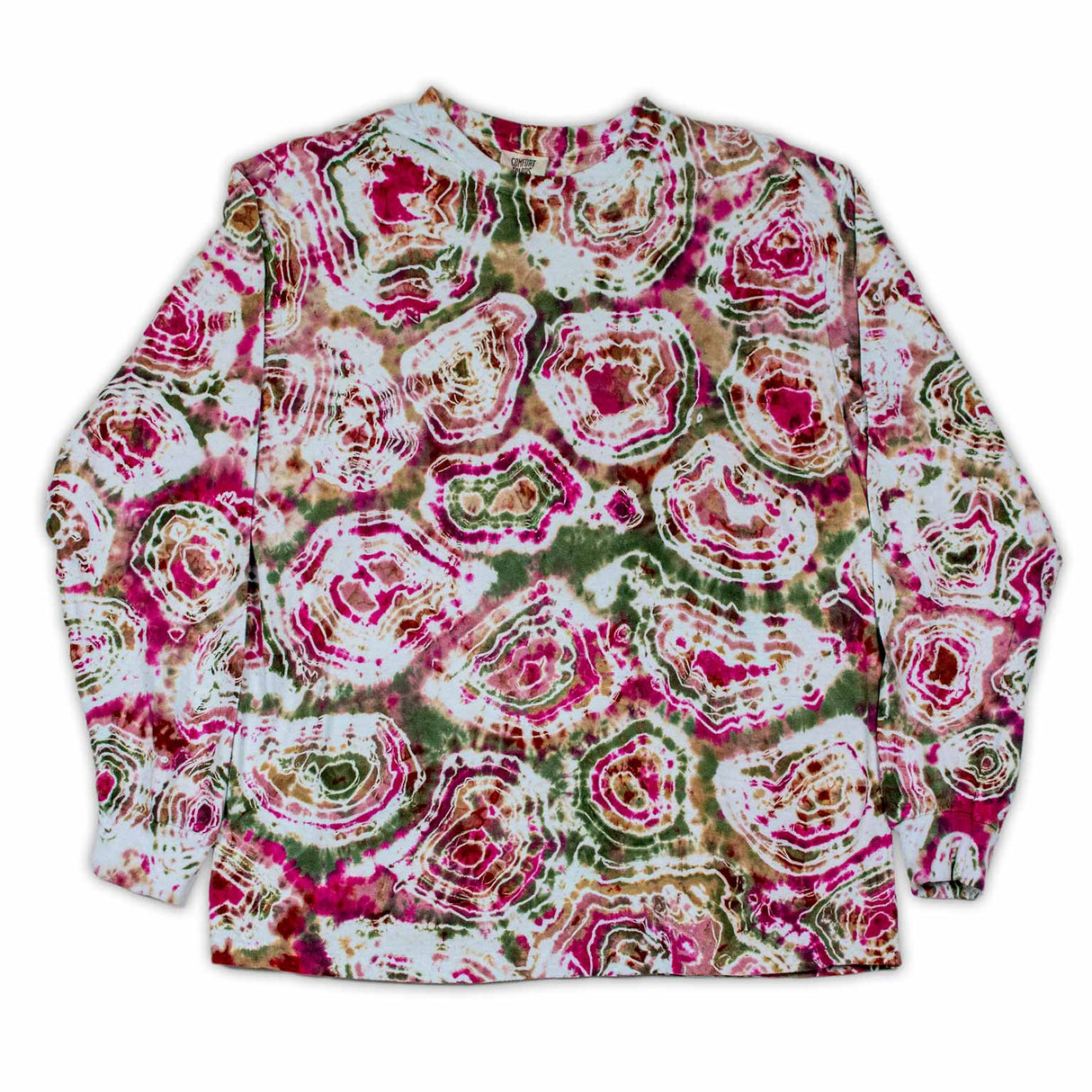 The long sleeve garment features a bold print that resembles cross-sections of gemstones, with rich pinks and greens dominating the design.