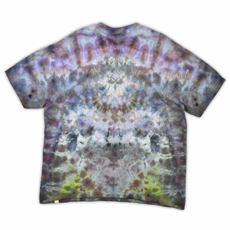 An eye-catching ice-dyed t-shirt showcasing a vibrant explosion of purples, pinks, and grays with a smoky effect around the 'dazed' text featured in the center.