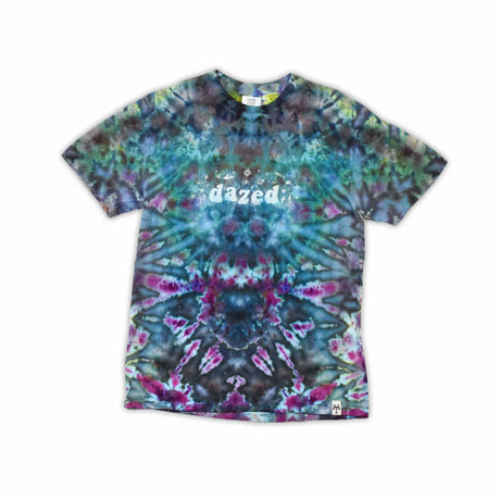 An ice-dyed t-shirt with a mesmerizing array of blues, purples, and subtle greens, reminiscent of a frozen geode, with 'dazed' in an icy font across the chest.