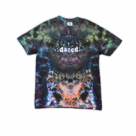 An ice-dyed t-shirt with a mesmerizing array of blues, purples, and subtle greens, reminiscent of a frozen geode, with 'dazed' in an icy font across the chest.