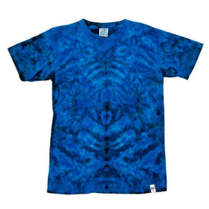 This t-shirt is adorned with a tie-dye design, creating a symmetrical pattern of rich blues that mimic the natural beauty of ocean waves.