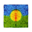 his bandana showcases a dynamic tie-dye representation of a sun with radiating beams, transitioning from a fiery orange core to a yellow halo, against a cool blue and green backdrop.