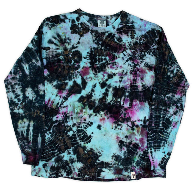 Long-sleeved t-shirt featuring a dual tie-dye technique, with intricate patterns of black crackle and bursts of pink and aqua blue, creating a visually striking and unique design.