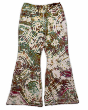 A pair of ice-dyed wide-leg pants that evoke the colors of the earth, with detailed patterns in shades of sage, wine, and sandstone.