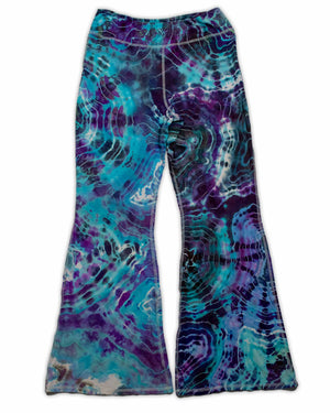 A pair of hand-dyed pants showcasing a unique ice-dye technique with organic patterns in a striking combination of sapphire, violet, and seafoam green.