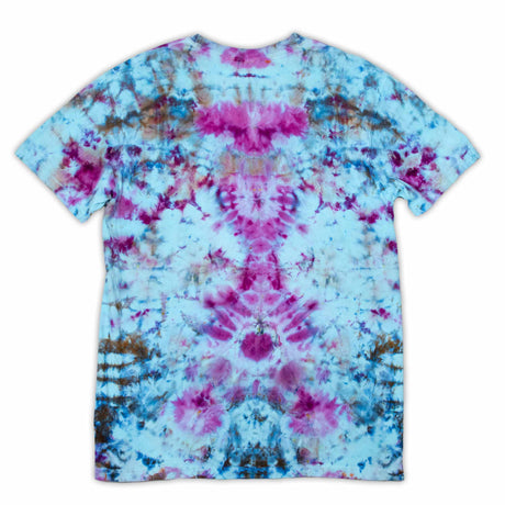 A t-shirt featuring a symmetrical ice dye pattern with a vibrant explosion of sapphire blues and fuchsia pinks against a soft blue background.