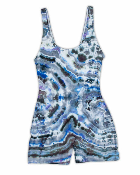 This form-fitting jumpsuit showcases a unique ice dye technique, evoking the beauty of geodes with layers of ultramarine, violet, and ash.