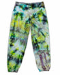 A pair of artistic ice-dyed sweatpants, with a kaleidoscopic effect of electric green, deep violet, and sky blue colors.