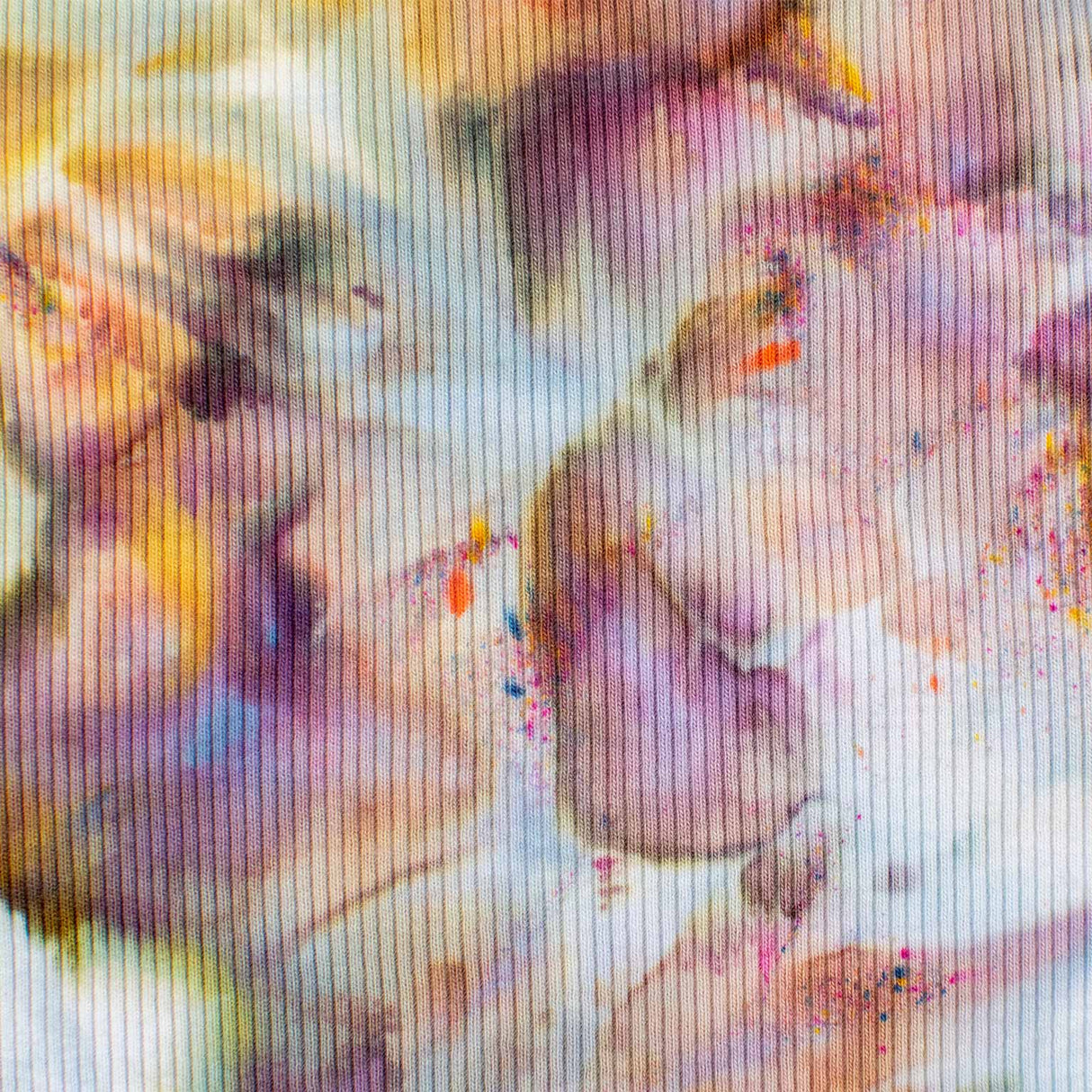 This tank top offers a dreamy ice-dyed canvas of dusty rose, pale violet, and creamy yellow, mingling in an impressionistic style.